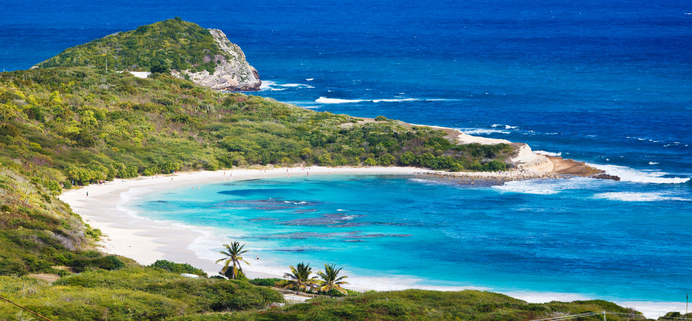 Image: Half Moon Bay, Antigua. (Photo Credit: MichaelUtech/iStock/Getty Images Plus)