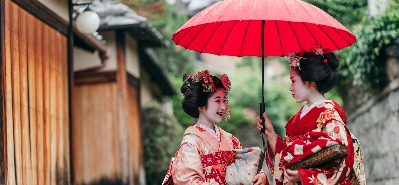 Image: Two maiko, trainee geishas, talk in Gion, Kyoto.  (Photo Credit: juripozzi / Adobe Stock)