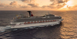 A sunlit Carnival Sunshine steaming to her next port-of-call