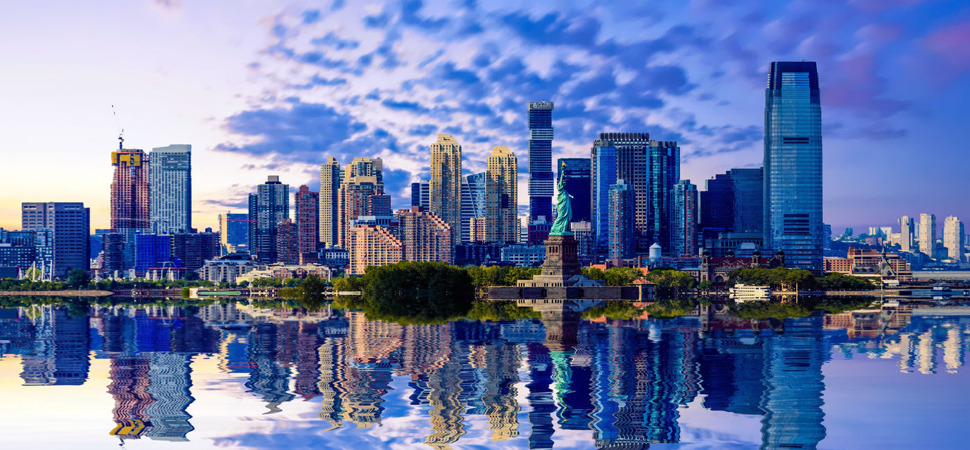 Image: View of Jersey City, New Jersey from New York Harbor. (Photo Credit: dbvirago/Adobe)