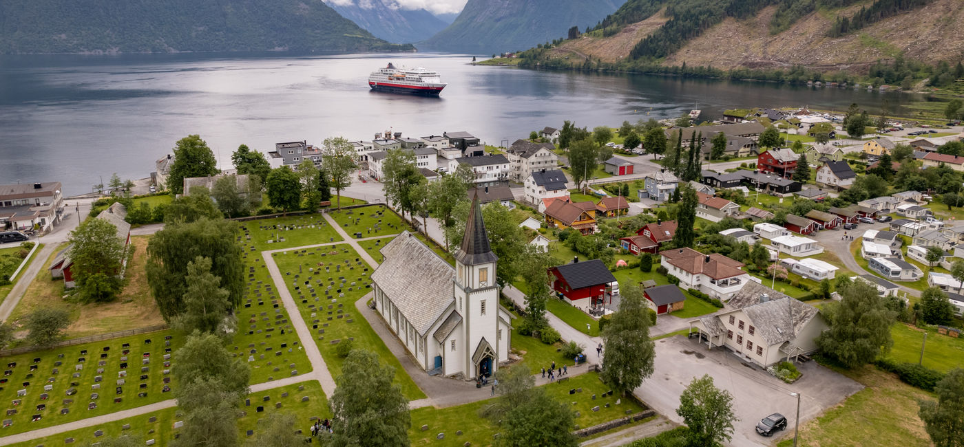 Image: A Hurtigruten ship in Saebo (Photo Credit: Michel Afflerbach / Hurtigruten)