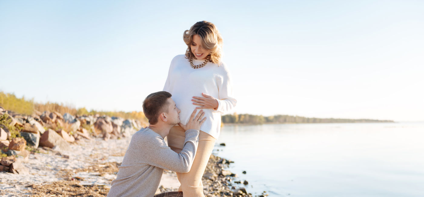Image: Couple celebrating on a babymoon. (Photo Credit: Viacheslav Yakobchuk/Adobe)