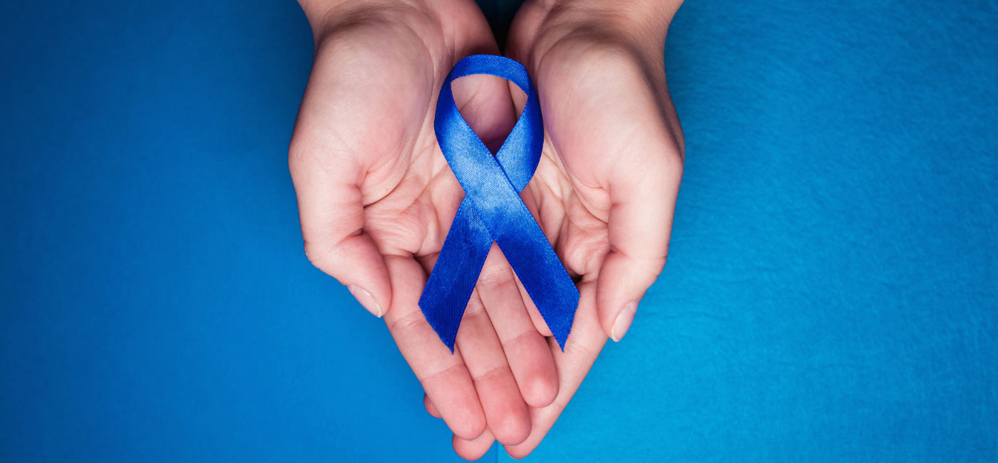 Image: A blue ribbon shows support for survivors of human trafficking and sexual slavery. July 30th is World Day Against Trafficking in Persons. (Photo Credit: andrey_orlov / Adobe Stock)