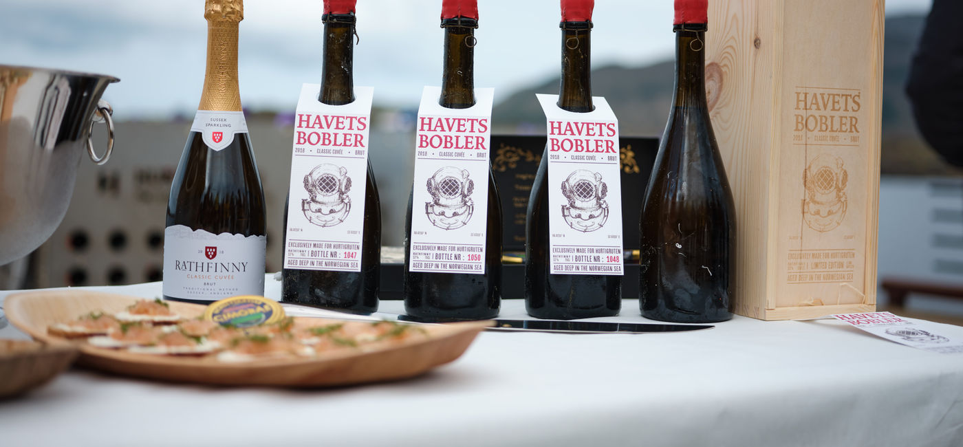 Image: Bottles from the initial batch of submerged sparkling wine (Photo Credit: Kristian Dale/Hurtigruten)