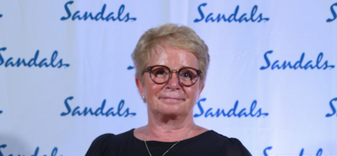Image: Rhonda Stanley, VP Talent Development, The Travel Agent Next Door accepts Top Beaches Agency- Canada award at Sandals Saint Vincent and the Grenadines.