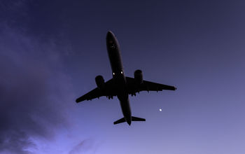 A plane flying at night, travel, redeye, flight,