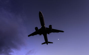 A plane flying at night, travel, redeye, flight,