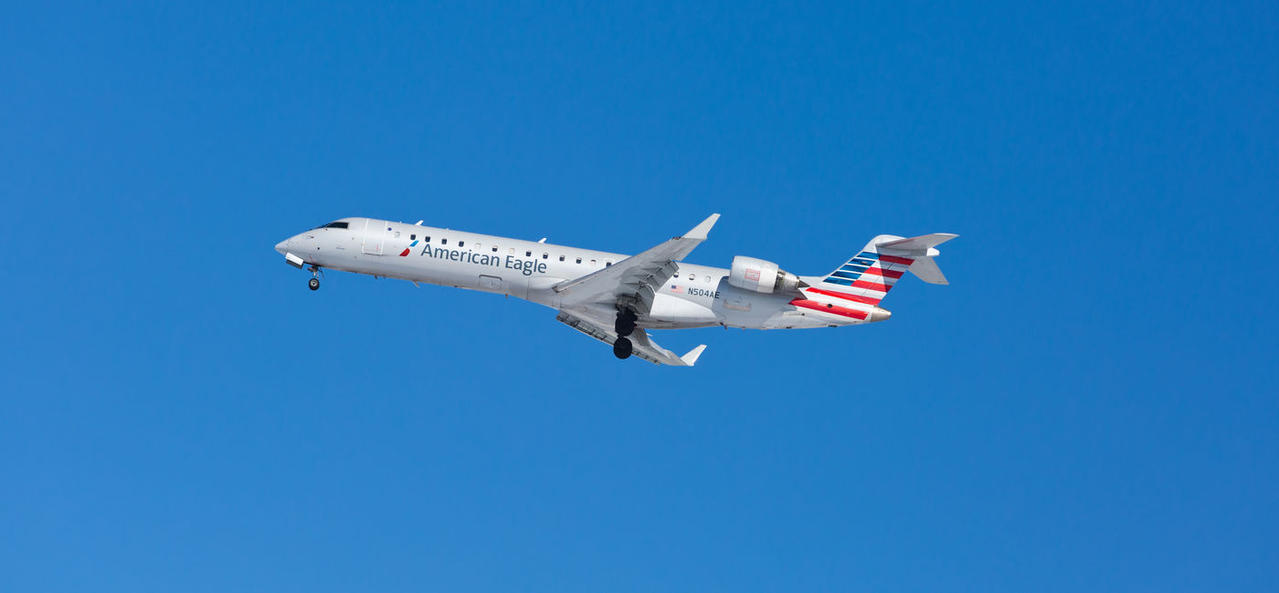 Image: American Eagle Bombardier jet landing. (Photo Credit: Carlos Yudica/Adobe)