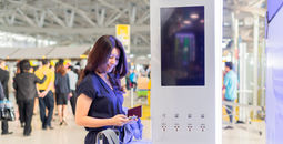 Woman charging her devices at an airport