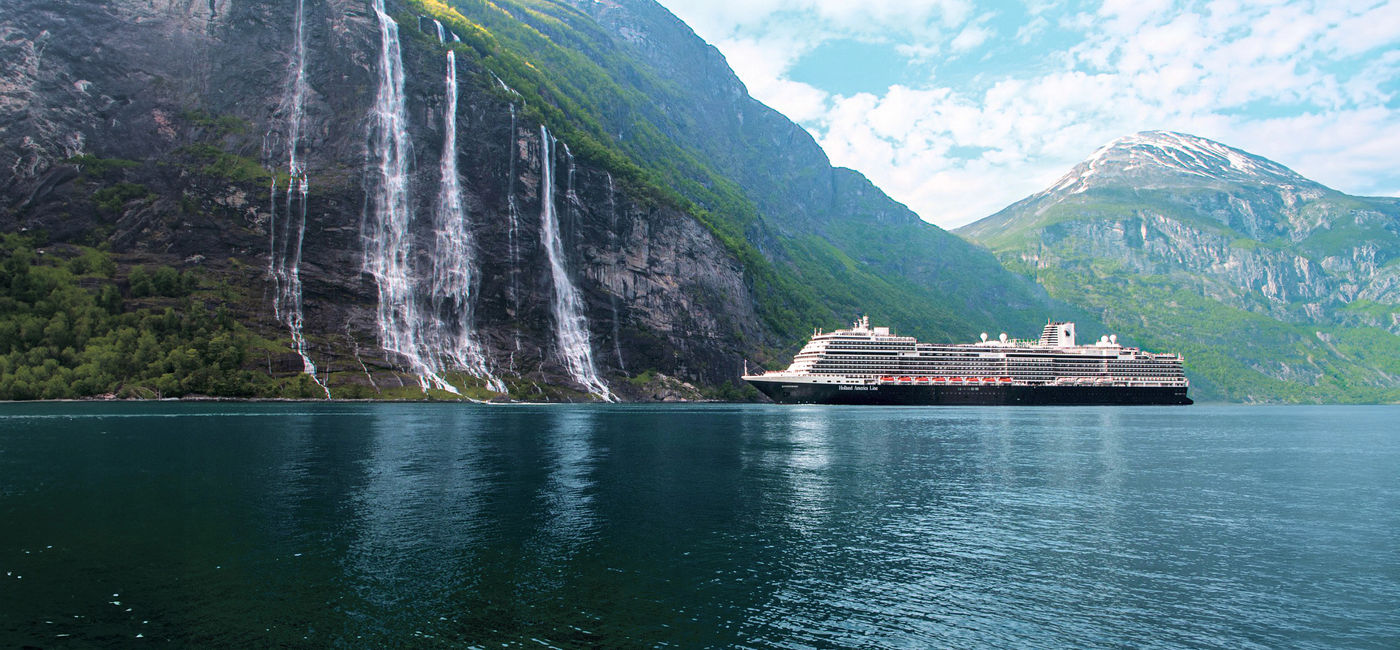 Image: A Holland America Line ship in Geirangerfjord (Photo Credit: Holland America Line)