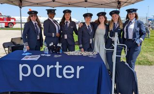 Porter Airlines female pilots, with young aspiring pilot, at annual 'Girls Can Fly' event