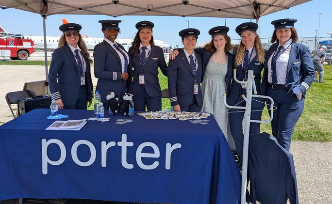Porter Airlines female pilots, with young aspiring pilot, at annual 'Girls Can Fly' event Porter Airlines female pilots, with young aspiring pilot, at annual 'Girls Can Fly' event