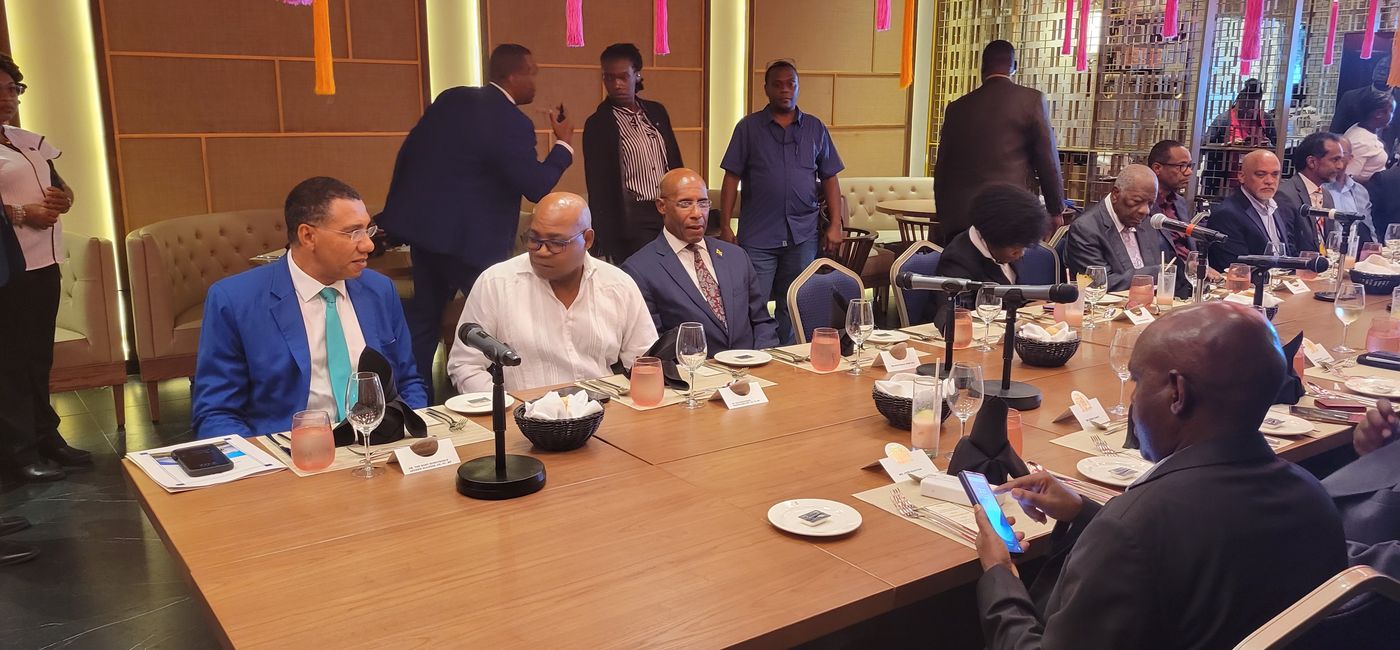 Image: “[Tourism] fosters cross-cultural exchange, promotes tolerance, and deepens our shared sense of humanity,” Andrew Holness, Jamaica prime minister (left) with Jamaica tourism minister Edmund Bartlett. (Photo by Brian Major)