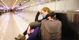 Traveler waiting for delayed flight.