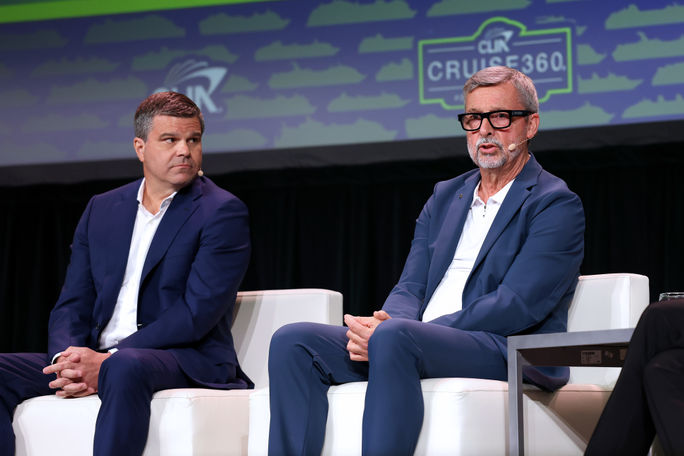 Frank A. Del Rio (left), president of Oceania Cruises, and Michael Bayley (right), president and CEO of Royal Caribbean International, speak on a panel at Cruise360