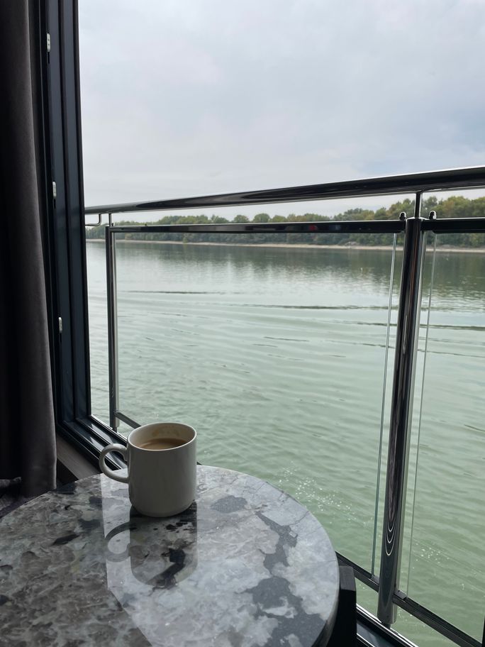 Enjoying a cup of coffee and scenic sailing