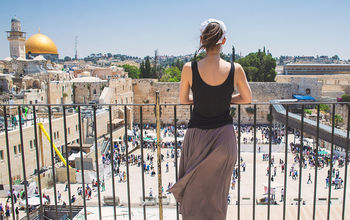 Woman looks on at Jerusalem old city, Israel