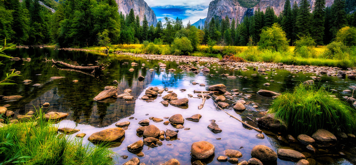 Image: View over the Merced River onto Yosemite National Park landmarks. (Photo Credit: Adobe Stock/Paul)