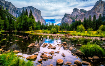 View over the Merced River onto Yosemite National Park landmarks.