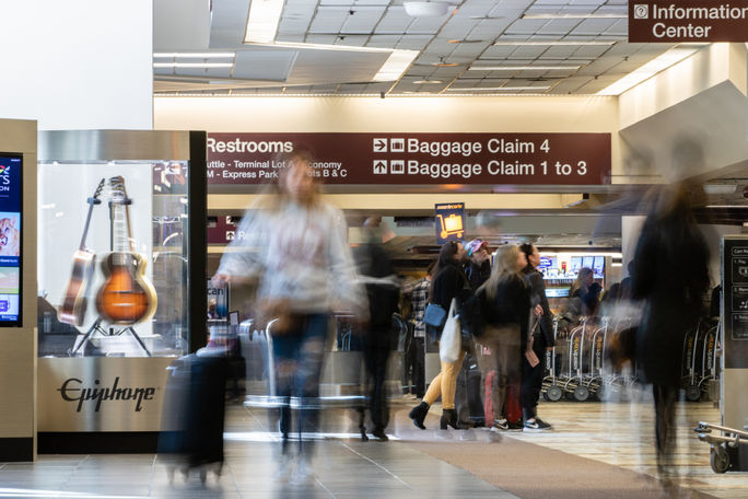 Travelers in the baggage claim area at Nashville International Airport 