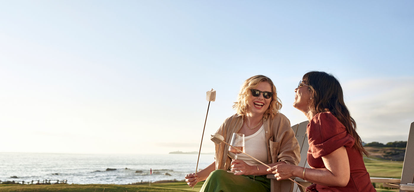 Image: Friends enjoying the fire pit at The Ritz-Carlton, Half Moon Bay near San Francisco. (Photo Credit: The Ritz-Carlton, Half Moon Bay)