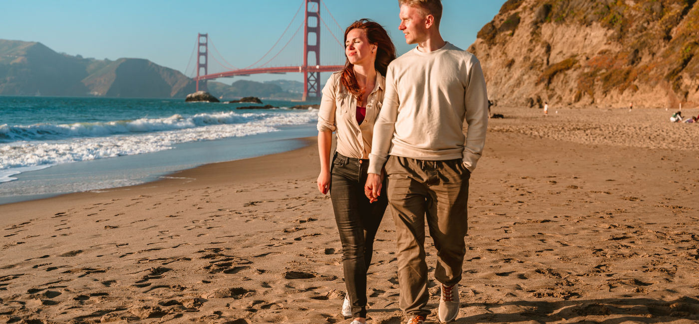 Image: Couple enjoying a walk in San Francisco, California. (Photo Credit: Adobe/KseniaJoyg)
