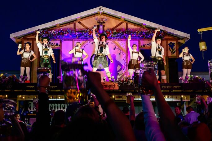 The crowd raises a toast during a performance at Linde Oktoberfest Tulsa. Tulsa, Oktoberfest, Linde Oktoberfest Tulsa