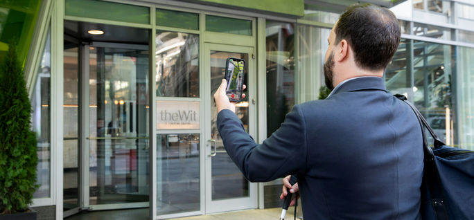Hilton's new partnership with Be My Eyes will help improve accessibility for low-vision and blind guests. Hilton, Be My Eyes, travel technology, accessibility, accessibility technology