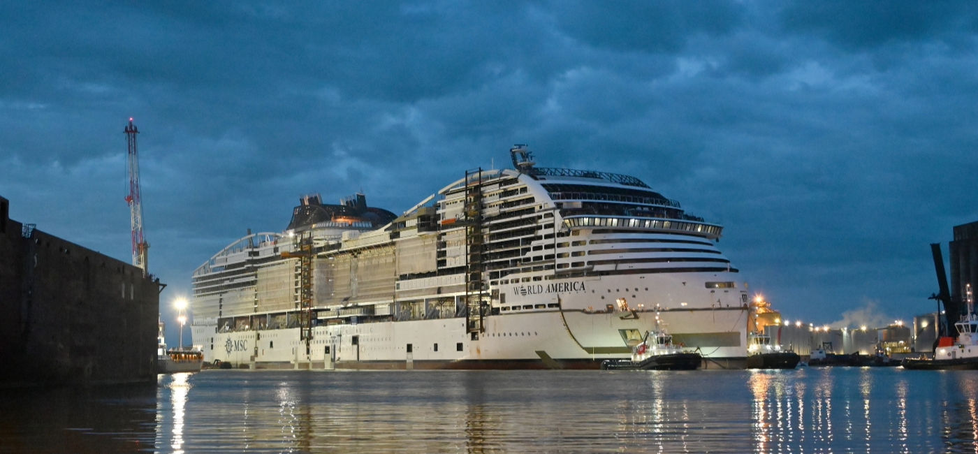 Image: The MSC World America recently touched water for the first time for its float-out, entering its last phase of construction. (Photo Credit: MSC Cruises)