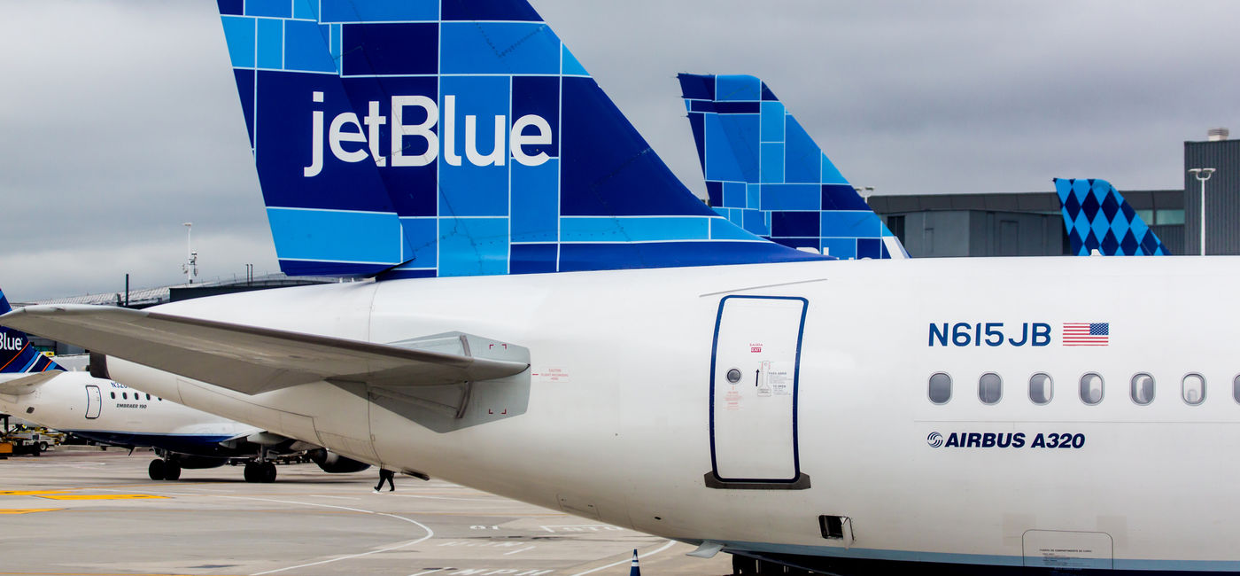 Image: Airbus A320 JetBlue tailfin with Mosaic design. (photo via rypson / iStock Editorial / Getty Images Plus)