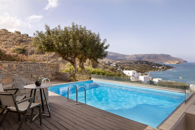 A private pool in a fresh housing selection room at Domes Aulus elounda all including the complex, Hilton Collection Curio. Hilton, all-inclusive resorts in Greece, Greece Resorts, Hilton Hotels in Greece, All-Inclusives
