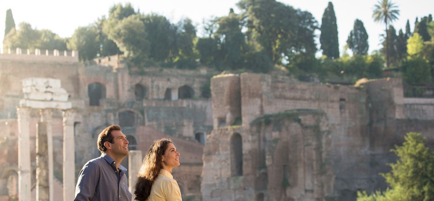 Image: A couple wanders through ruins in Rome, Italy. (Photo Credit: Globus)
