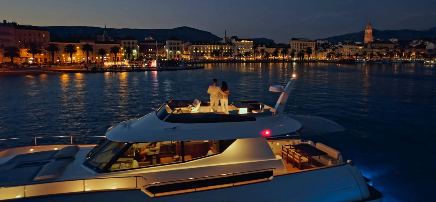Image: A couple sail on a private yacht along the coast of Split, Croatia with Kensington Ultraluxe. (Photo Credit: Kensington)