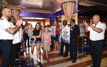 The Litteral family walking onto the Carnival Valor