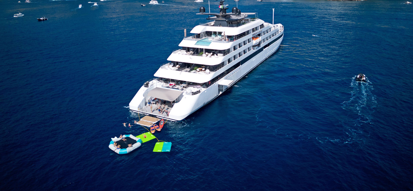 Image: Aerial view of the Emerald Sakara superyacht on the Amalfi Coast. (Photo Credit: Scenic Group)