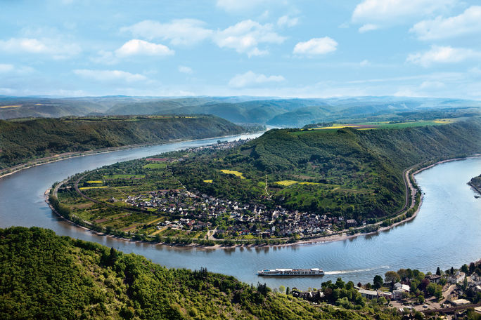 A Uniworld Boutique River Cruises ship sails around a bend in the Rhine River near Boppard, Germany. A Uniworld Boutique River Cruises ship sails around a bend in the Rhine River near Boppard, Germany.