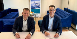 John Weatherill, WestJet EVP and CCO with Paul Verhagen, SAS EVP and CCO signing at the IATA AGM in Delhi, India