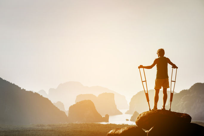 Hiker on crutches, protect your trip with travel insurance
