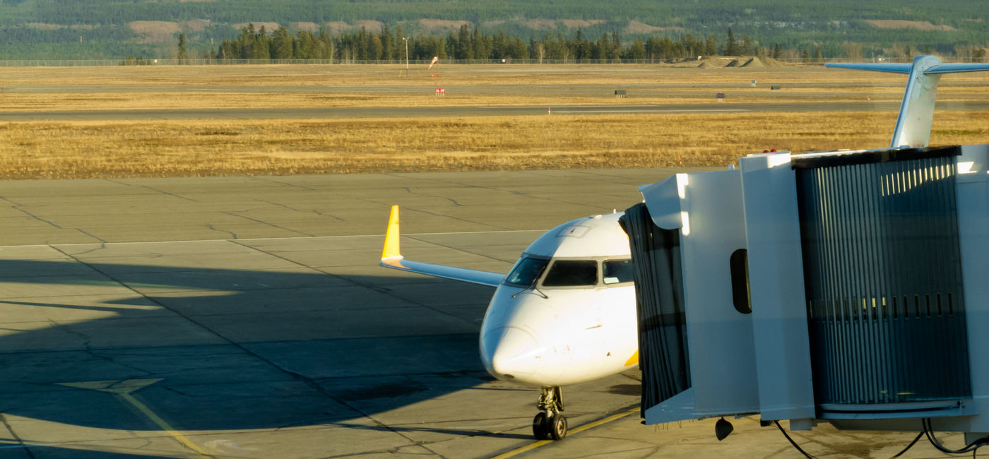Image: Aircraft docked at Whitehorse airport Yukon Canada (Photo Credit: Adobe Stock)
