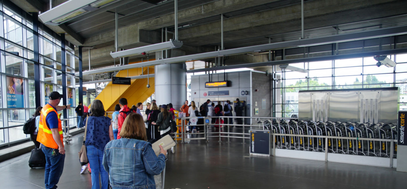 Image: Passengers waiting at Seattle–Tacoma International Airport. (Photo Credit: cascoly2 / Adobe Stock)