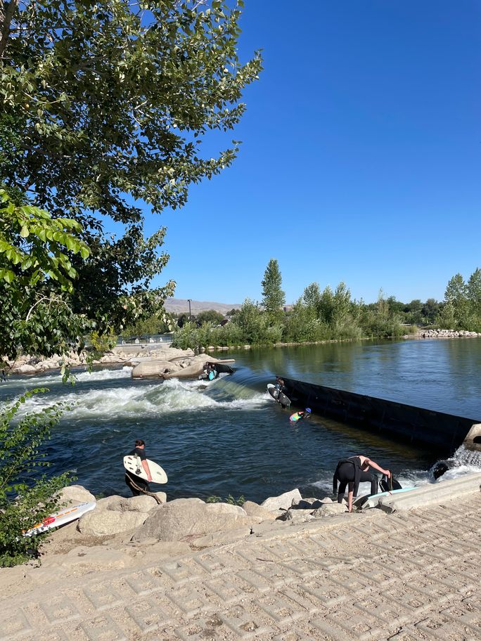 Surfers at Boise Whitewater Park in Boise, Idaho