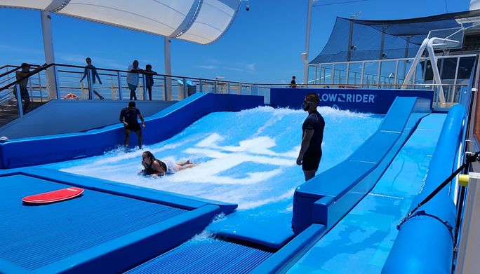 The FlowRider wave simulator aboard Utopia of the Seas. The FlowRider wave simulator aboard Utopia of the Seas.