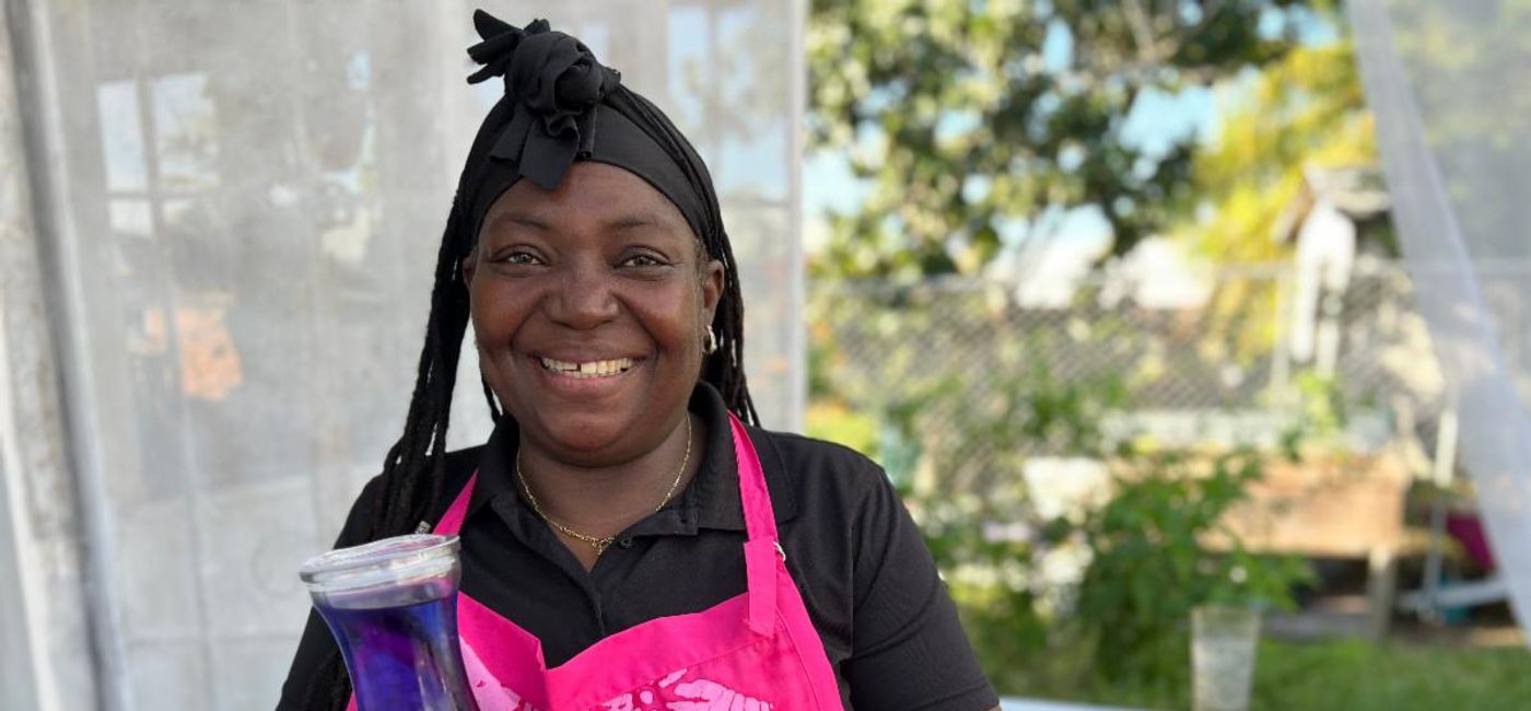 Image: Volunteer Ambassador Collete Williams shares her home-made Butterfly Pea Tea - Photo courtesy of Jennifer Bain. (Photo Credit: Bahamas Ministry of Tourism)