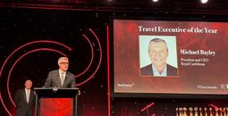 Michael Bayley accepts Travel Executive of the Year award at 2025 Travvy ceremony.