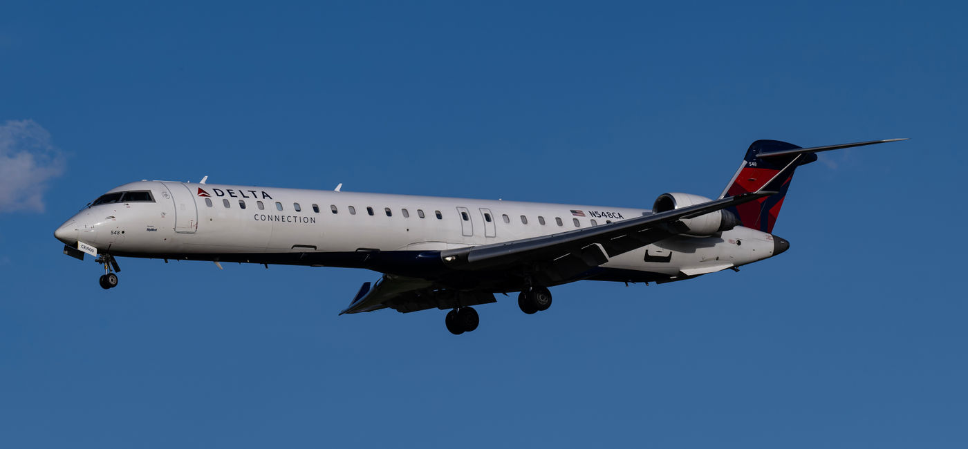 Image: Delta Connection flight Bombardier CRJ900. (Photo Credit: robin/Adobe)