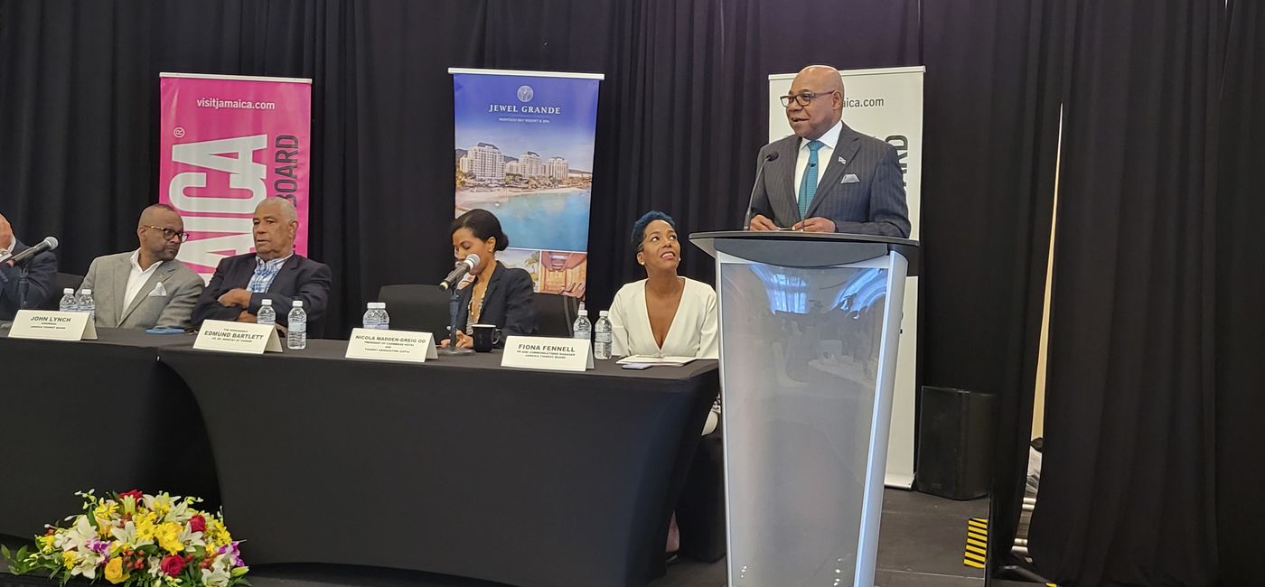 Image: “The [tourism] industry has enjoyed a record-breaking year.” – Edmund Bartlett (right), Jamaica’s tourism minister. (Photo by Brian Major)