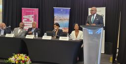 Edmund Bartlett speaking with Jamaica tourism officials