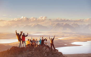 Large group of friends in mountains area.