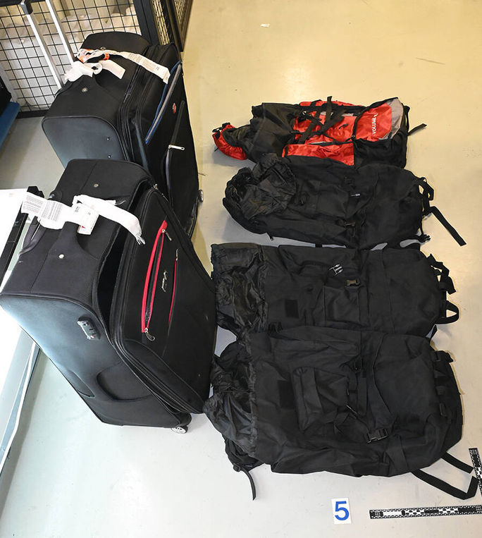 Luggage containing drugs seized during the investigation.