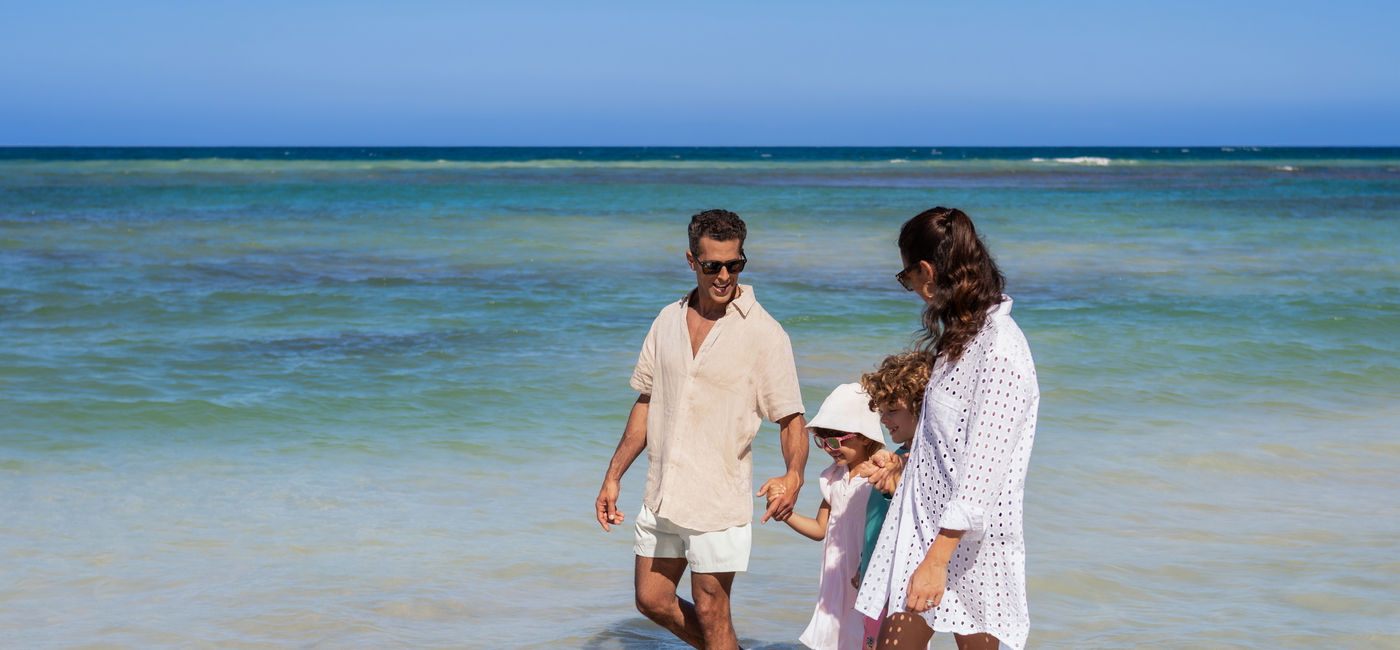 Image: A family on the beach at Wyndham Alltra Punta Cana (Photo Credit: Aimbridge Hospitality)